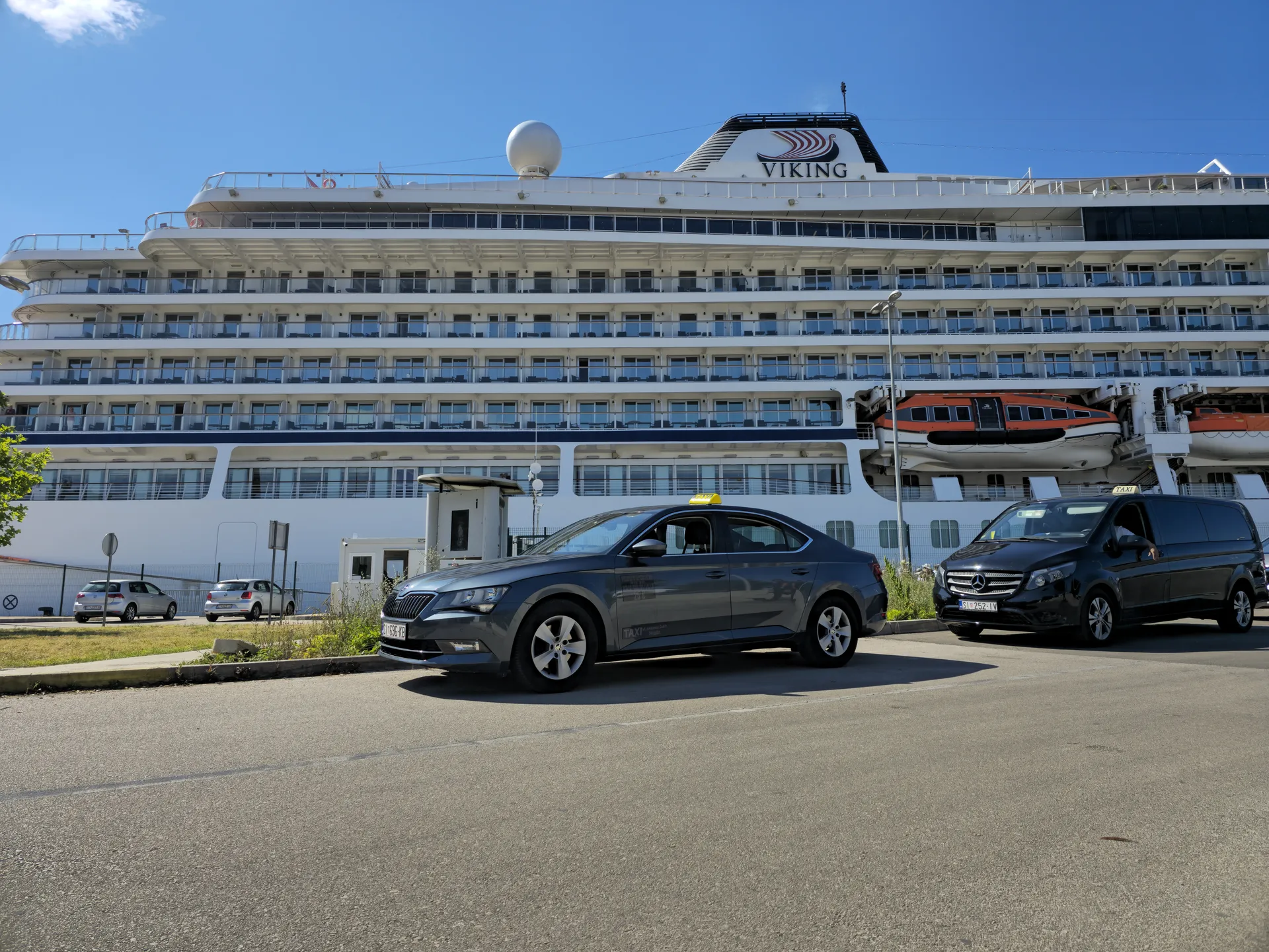 Taxi Antonio at the Šibenik cruise port beside a Viking cruise ship, ready for a Krka day trip pickup